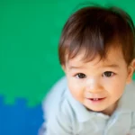 Young boy with brown eyes looks at camera