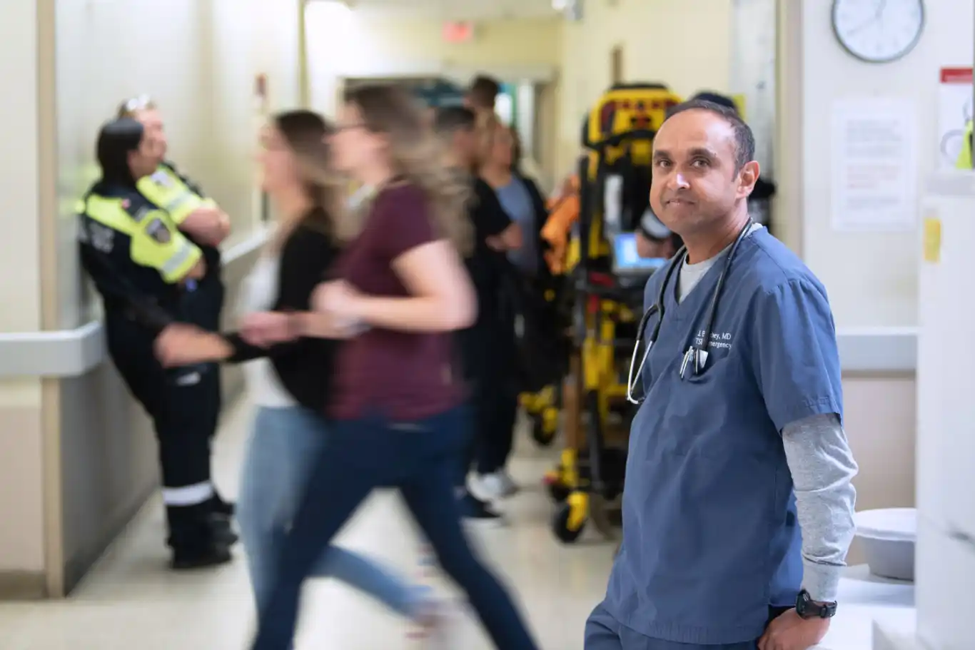 Doctor walking through hallway