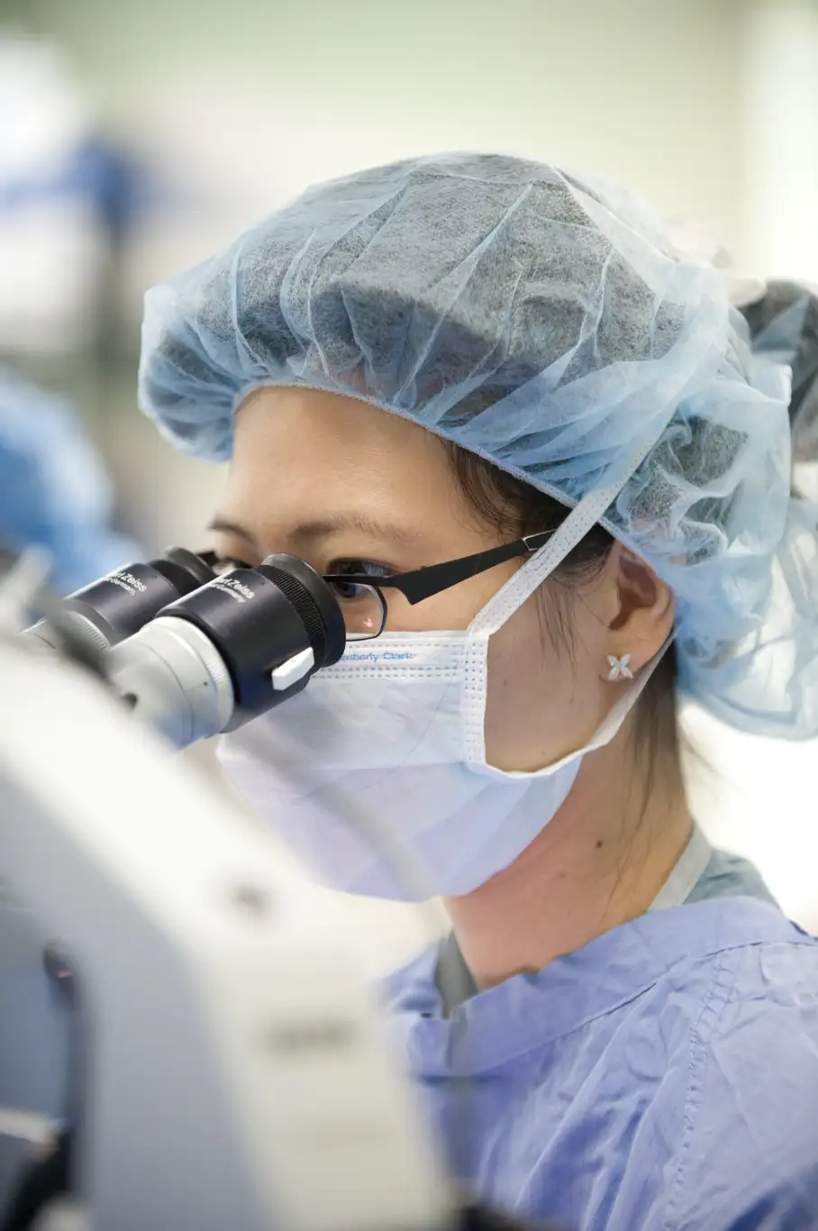 Doctor looks through scope